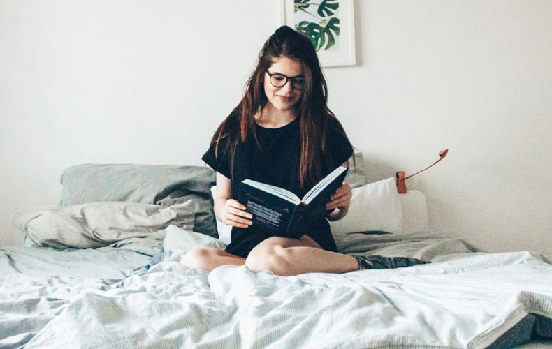 Young Woman Reading a Book